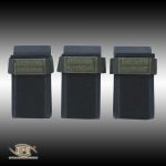 Three O.P.S. adjustable molded polymer magazine inserts with hook and loop backing on a white background.